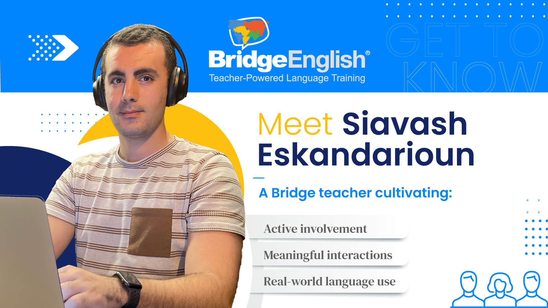 BridgeEnglish teacher Siavash sits at his desk working.